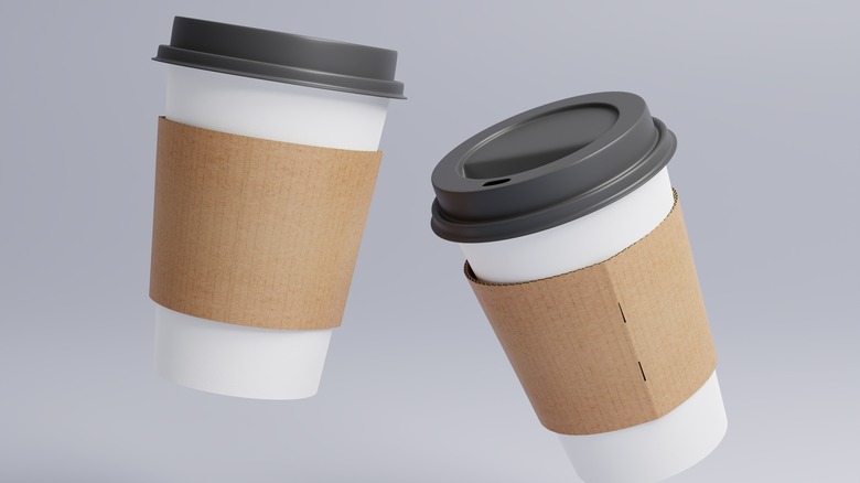 Two paper to-go coffee cups