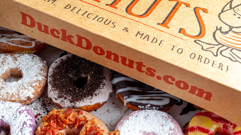 Assorted donuts in Duck Donuts box