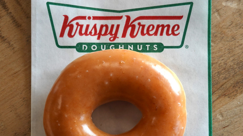 Krispy Kreme donut on branded paper bag