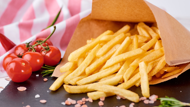 bagged French fries with tomatoes