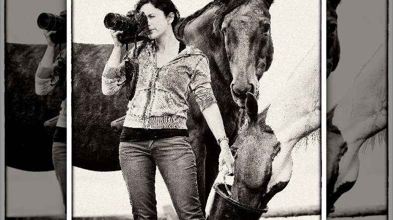 Ami Vitale posing with horses