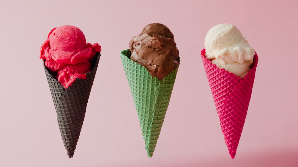 different flavors of ice cream in brightly colored cones