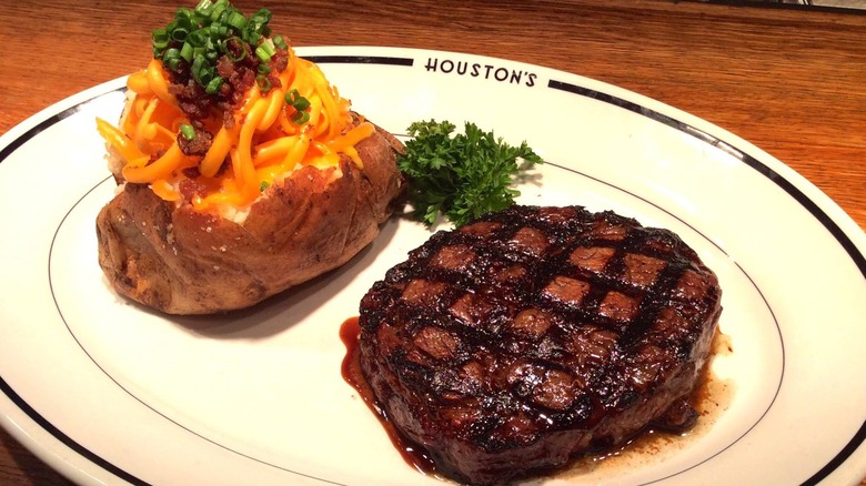 Steak and potato on plate