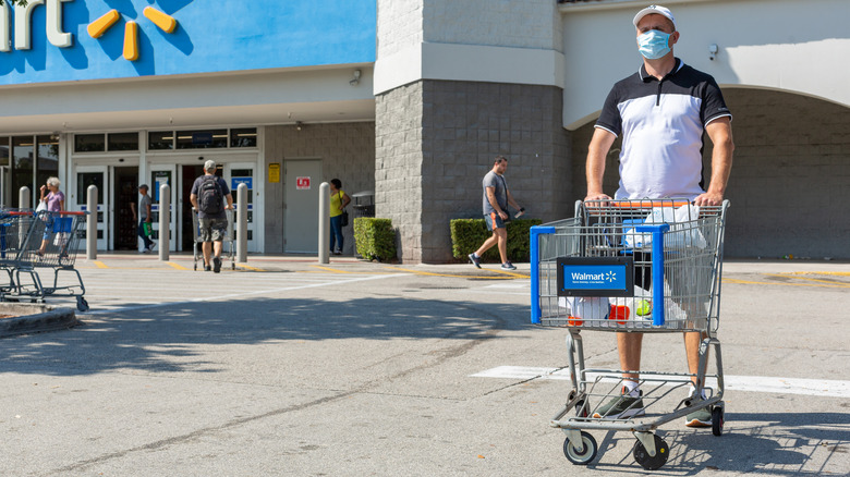 Man with Walmart cart