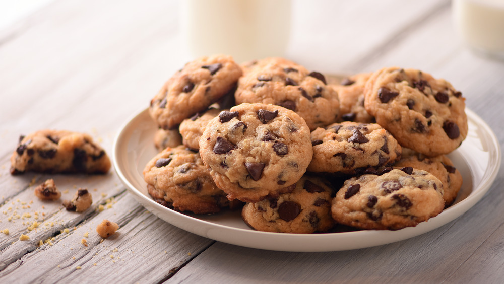 Plate of chocolate chip cookies on table