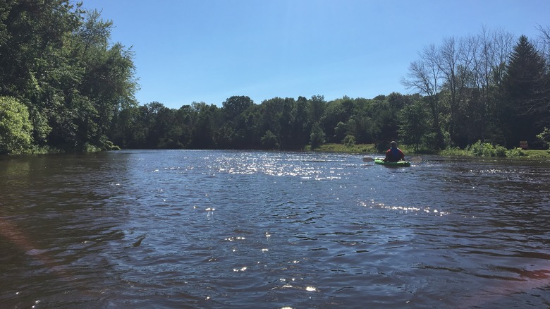 man rowing across Michigan's Muskegon River