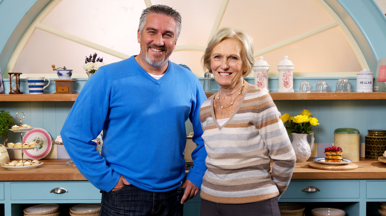 Paul Hollywood and Mary Berry smiling in the kitchen