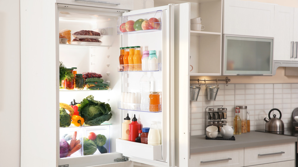 Open fridge in kitchen