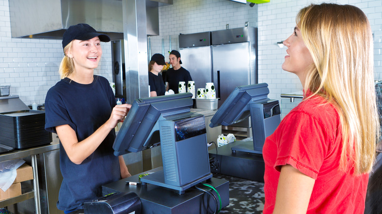 teen working in grocery store