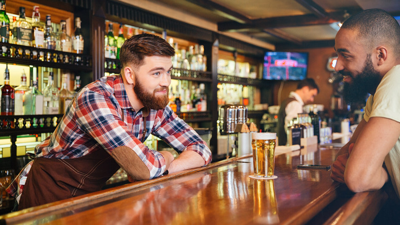 Man opening up to bartender