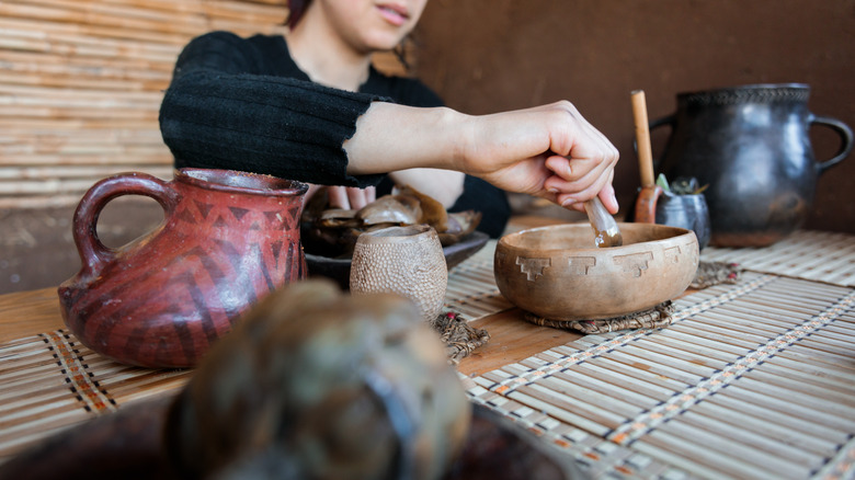 Indigenous person preparing food