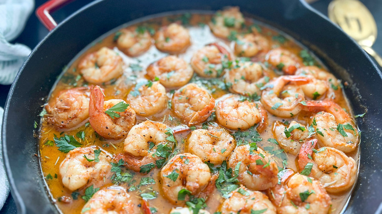 cooked shrimp with green garnish