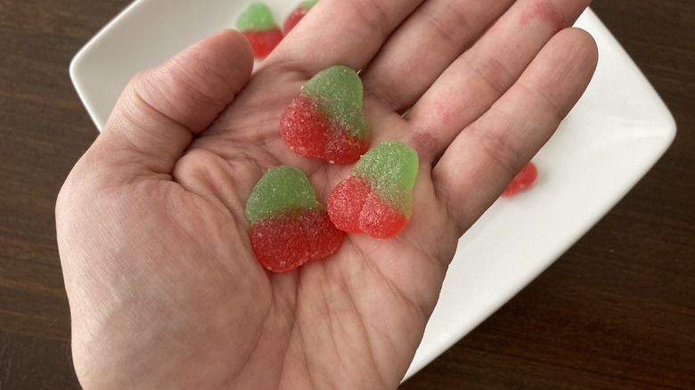 Sour Patch Cherry candies in palm