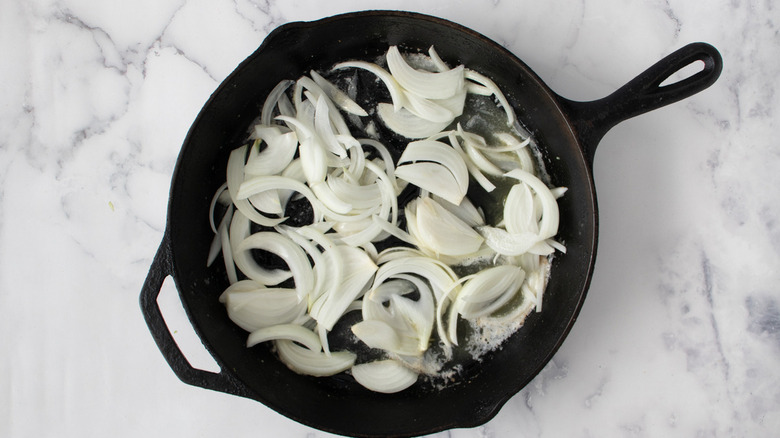 onions sauteing in skillet