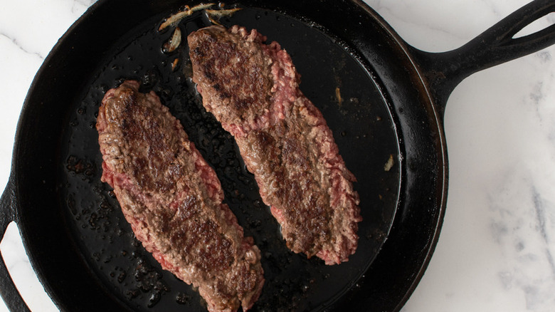 searing beef in skillet