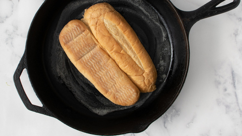 hoagie bun toasting in skillet