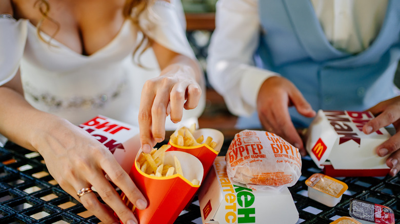 bride and groom eating McDonald's