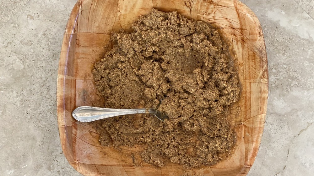 Almond butter and maple syrup combined in a bowl