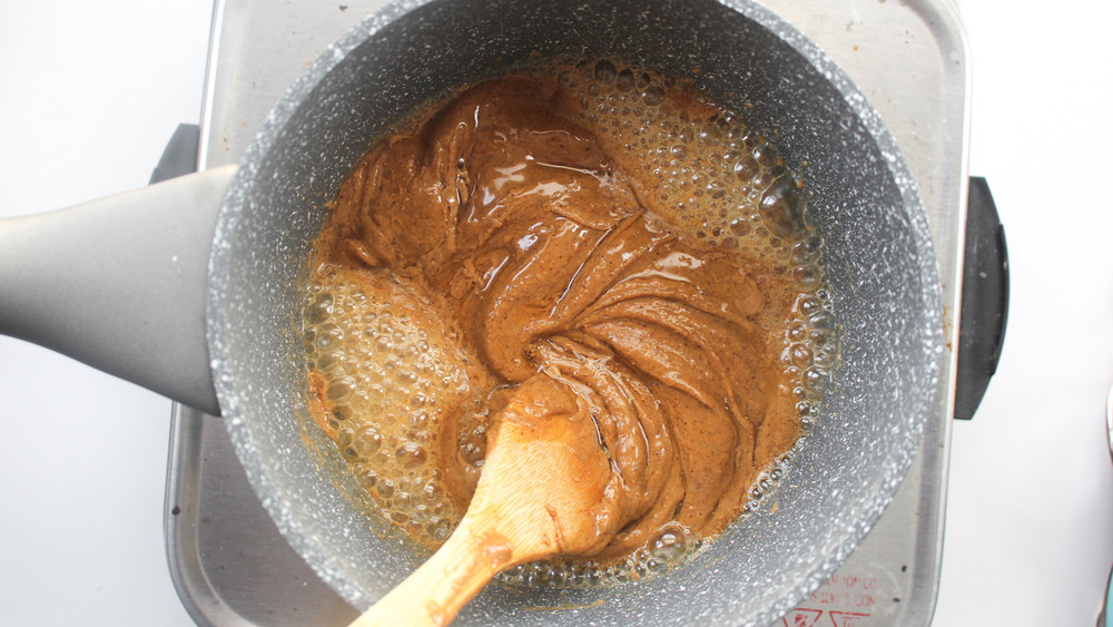 Honey and peanut butter in a pan