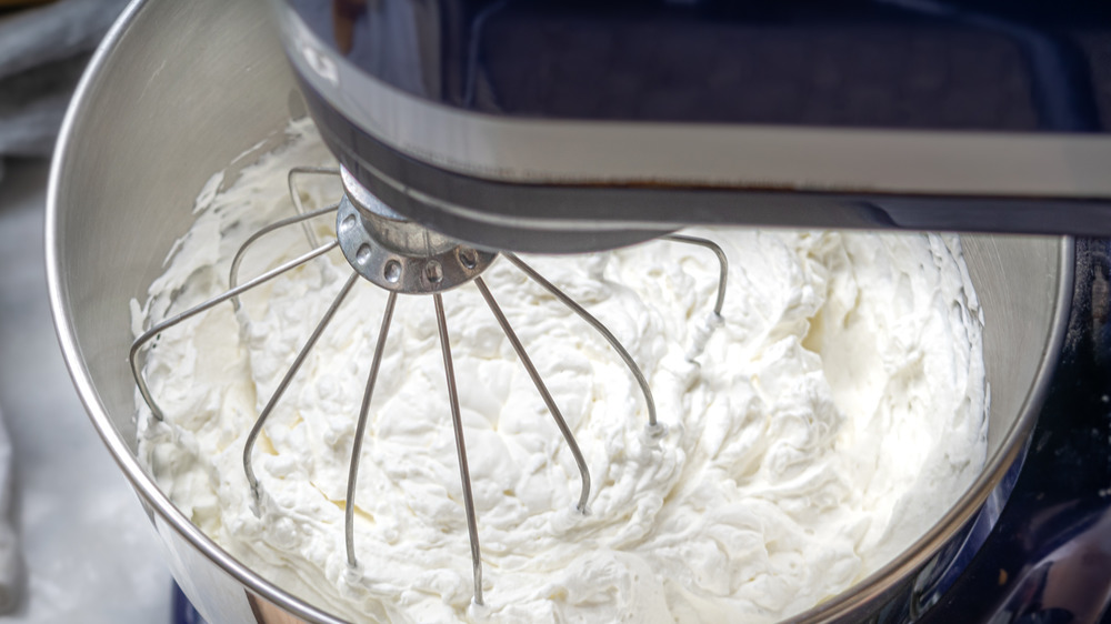 mixing whipped cream for peppermint pie