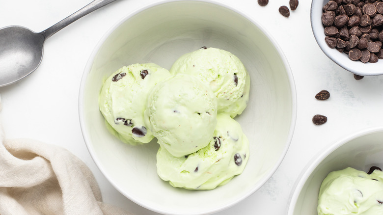 Scoops of mint chocolate chip ice cream in bowl