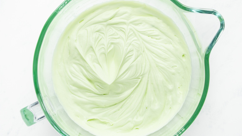 Mint ice cream mixture in mixing bowl