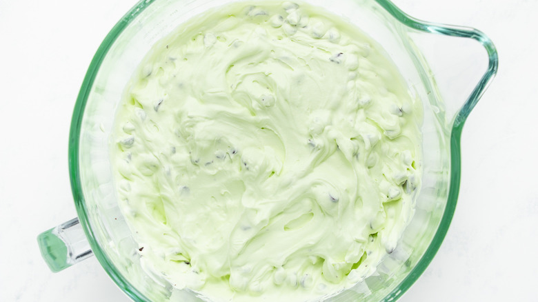 Mint chocolate chip ice cream mixture in mixing bowl