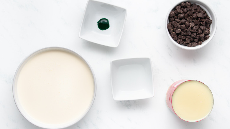 Mint chocolate chip ice cream ingredients in bowls