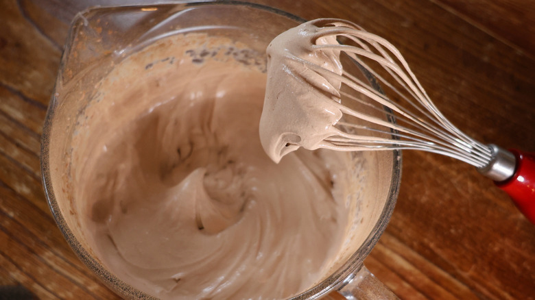 whisk over bowl of chocolate whipped cream