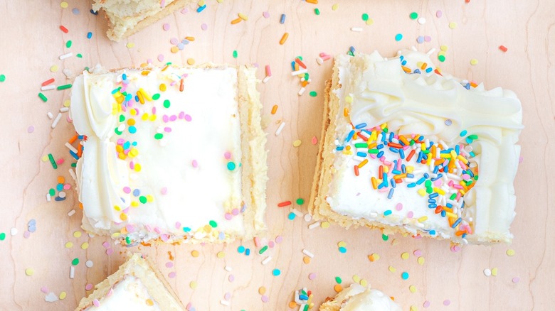 vanilla frosted cake with sprinkles