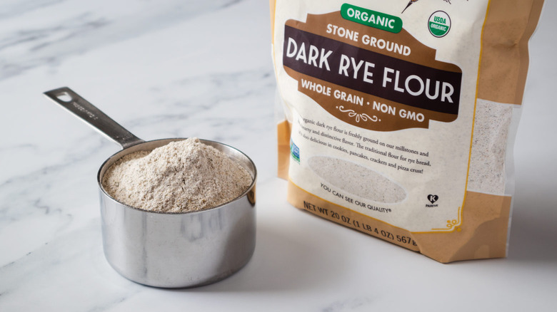 rye flour in measuring cup