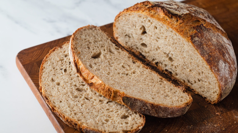 sliced rye bread on cutting board