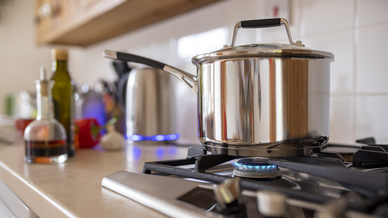 Saucepan with lid on stove