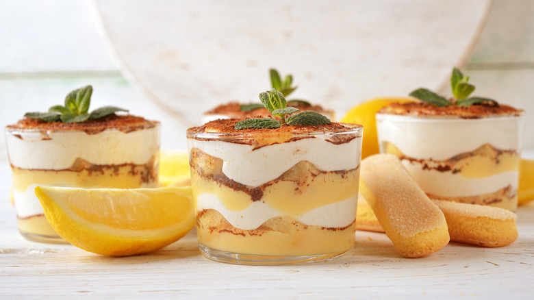 lemon tiramisu in glasses with mint garnish