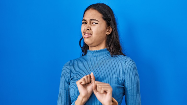 young woman looking disgusted