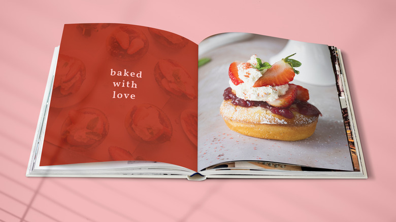 Cookbook against a pink background