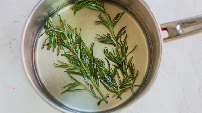 syrup and rosemary in saucepan 