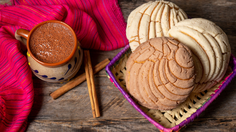 Mexican hot chocolate with bread in a basket