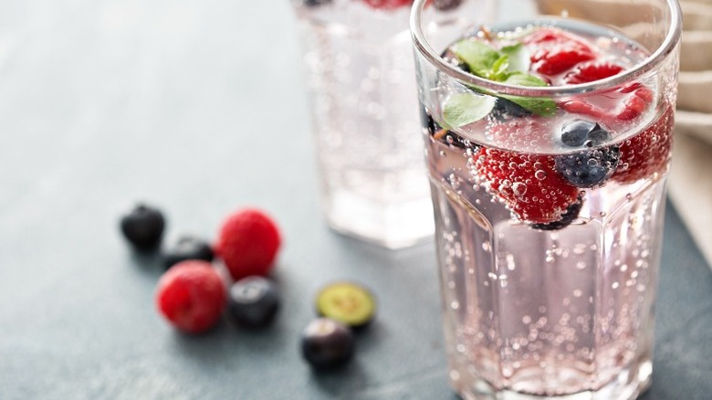 sparkling water glass with berries