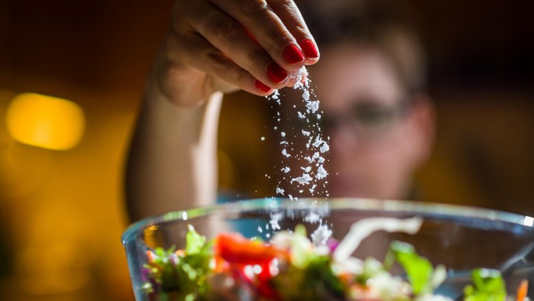 woman salting food