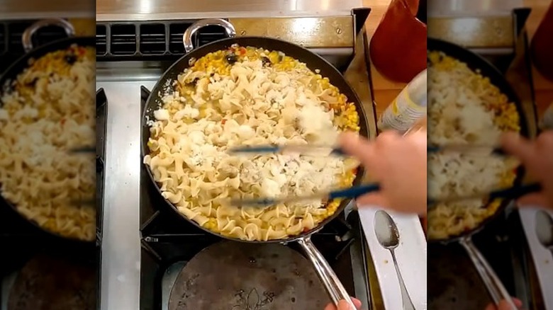 A pan of pasta with corn