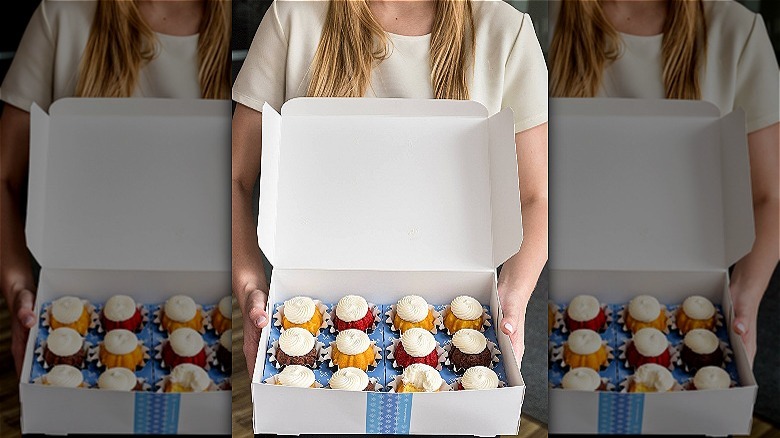 woman holding nothing bundt cakes box