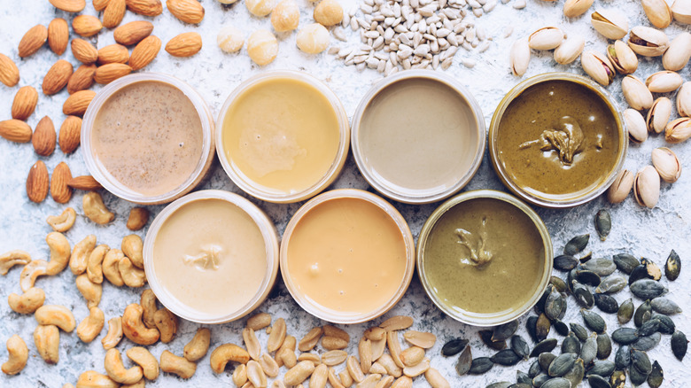 Nuts and seeds and jars of homemade nut butters 