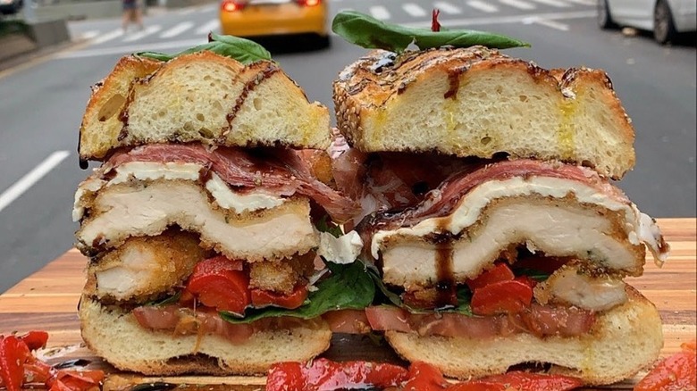 chicken sandwiches on wooden board