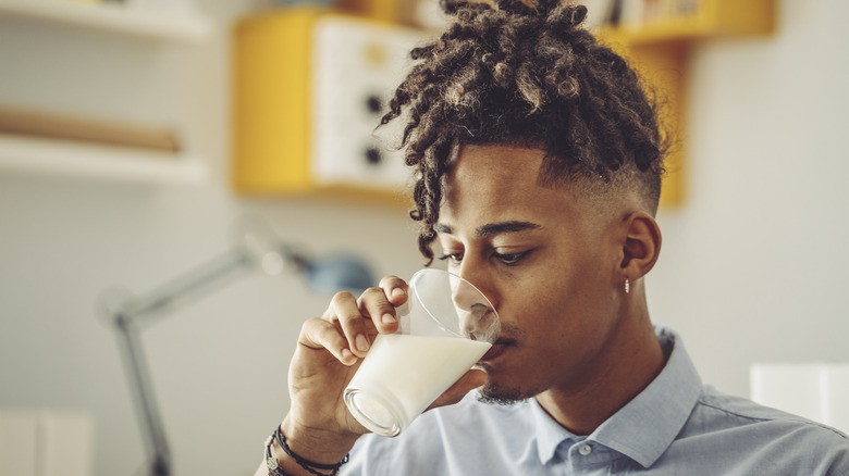 person drinking milk