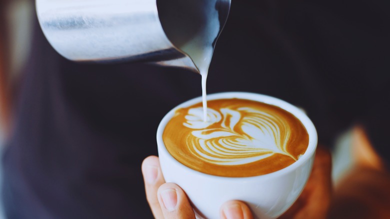 person making latte art