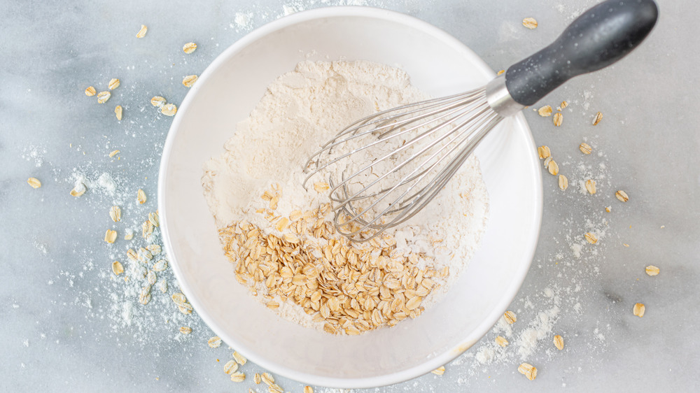 mixing flour and oats