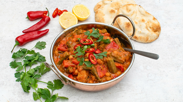 okra, chickpea, and potato coconut curry in dish