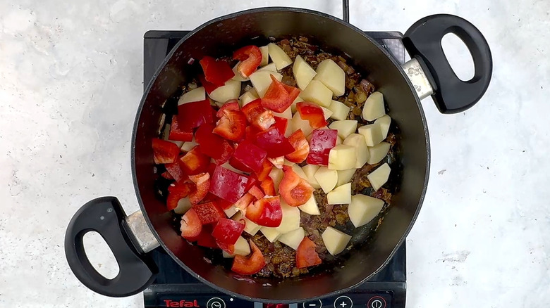 potato and red bell pepper in pan