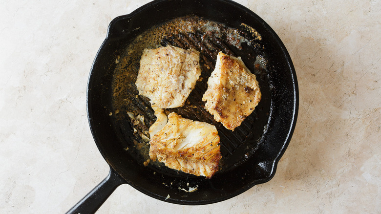 three cod fillets in grill pan